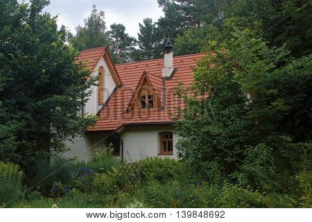 White vintage house in the trees photo