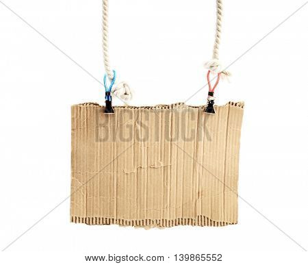 old piece of cardboard on rope