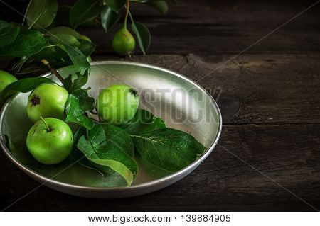 Fresh Green Apples With Leaves On Dark Rusric Background.
