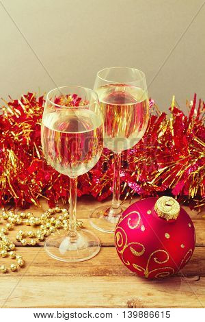 Christmas holiday celebration with glass of champane and ornamnets