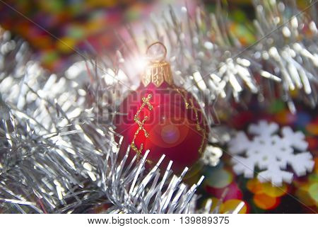 bright Christmas balls with reflections and colored tinsel