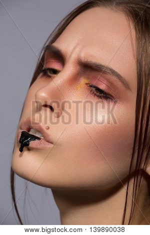beauty creative makeup with black drib lips