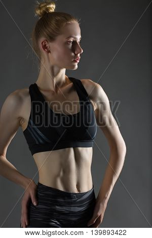 Beautiful sexy blonde woman perfect athletic slim figure engaged in yoga exercise or fitness lead healthy lifestyle eats right dressed in comfortable casual clothes sport pilates diet
