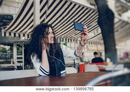 Girls walking around town, sit in cafes and pictures on phones
