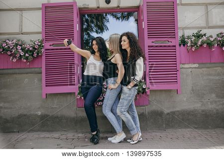 Girls walking around town, sit in cafes and pictures on phones