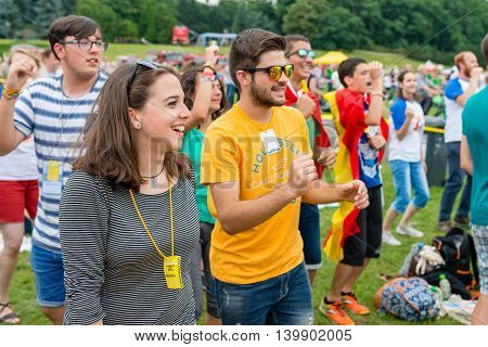 Poznan POLAND - JULY 24 2016: pilgrims praying dancing and singing during Days In Dioceses just before The World Youth Day in Krakow; WYD is a meeting of youth from all over the world