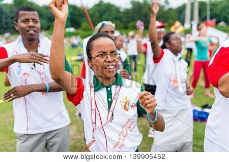 Poznan POLAND - JULY 24 2016: pilgrims praying dancing and singing during Days In Dioceses just before The World Youth Day in Krakow; WYD is a meeting of youth from all over the world