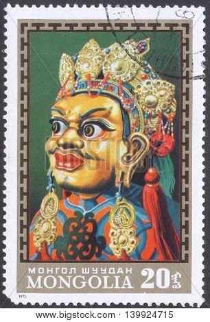 MOSCOW RUSSIA - CIRCA FEBRUARY 2016: a post stamp printed in MONGOLIA shows a traditional Mongol mask the series 