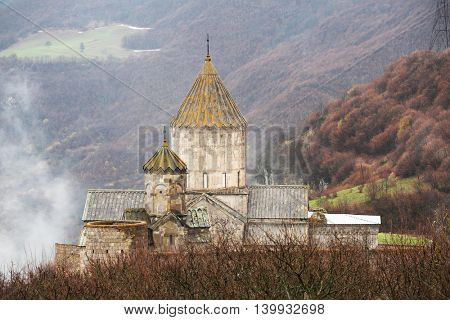 Ancient monastery Tatev covered with clouds in the mountains of Armenia. Was founded in year 906. 