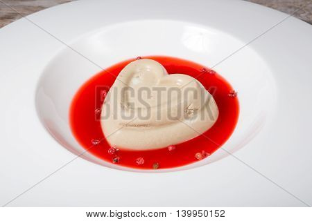 Heart shaped pate served with cranberry sauce