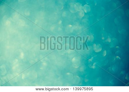 bokeh on turquoise background, light, abstract, texture.
