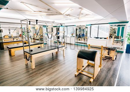 Trapeze table reformer ladder barrel in a pilates room