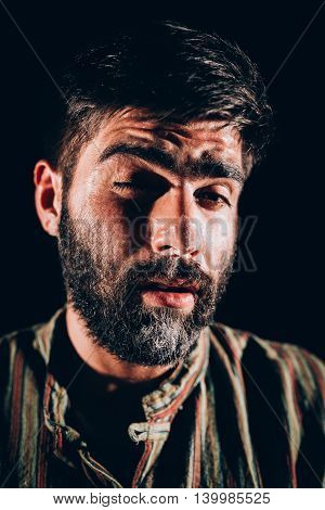 Bearded men being high after sniffing cocaine