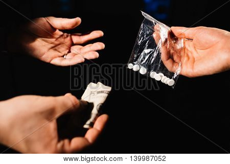 People dealing drugs drug addict buying and paying the dealer