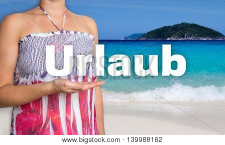 Urlaub (in german Holiday) concept is presented by woman on the beach.