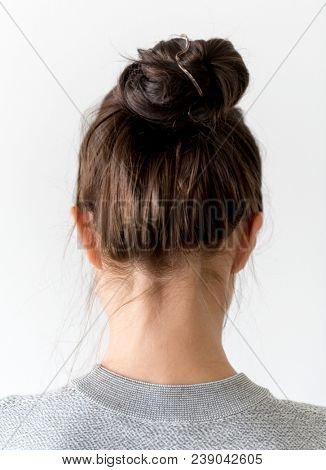 Woman making hair bun