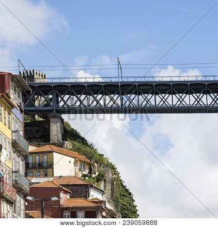 Bridge Built By Eiffel On The Bacground Of The Historical Centre Of The City Of Porto With Tradition