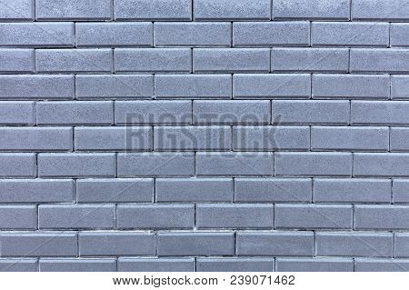 The Texture Of The Wall Is Made Of Gray Bricks Laid Horizontally