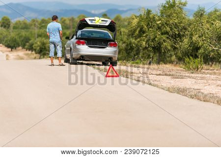 The Car Broke Down On The Road. Emergency Sign Close-up On The Road, Tarragona, Catalunya, Spain