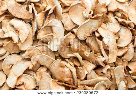 Background Of Sliced Dried Apples. Complete Filling Of The Autumn Harvest