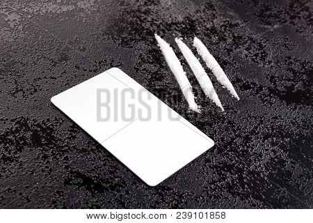 Cocaine Lines With White Plastic Card On Dark Surface.
