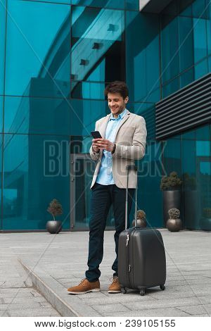 Reaching The Goal! Full Length Portrait Of The Young Smart Elegant Businessman Checking E-mail On Mo