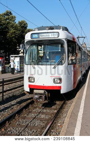 Dusseldorf, Germany - July 8, 2013: People Ride Rheinbahn Electric Tram In Dusseldorf, Germany. Duss