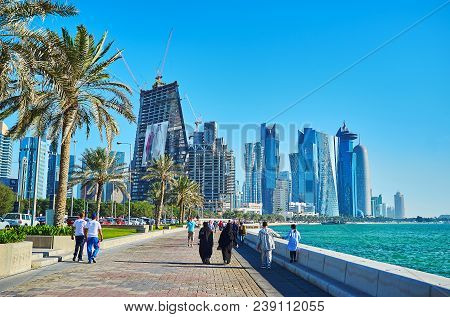 Doha, Qatar - February 13, 2018: The Pleasant Walk Along The Modern Buildings Of Al Dafna District -