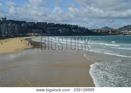 Several People Practicing Kayak On The Beach Of La Concha In San Sebastian. Sport Travel Nature. Mar