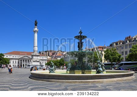Lisbon, Portugal - July 25, 2009: View Of The Rossio Square With Tourists Walking By, In The Pombali