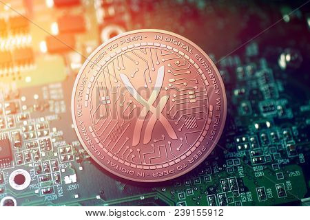 Shiny Copper Airporn Cryptocurrency Coin On Blurry Motherboard Background Token