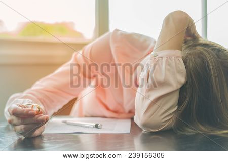 Great Concept Of Divorce, End Of Relationship, Sad Young Woman, Signing Divorce Agreement, With Hand