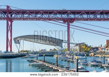 Lisbon, Portugal - Nov 26, 2013 : Santo Amaro Docks With 24th April Bridge In The Background In Dayl