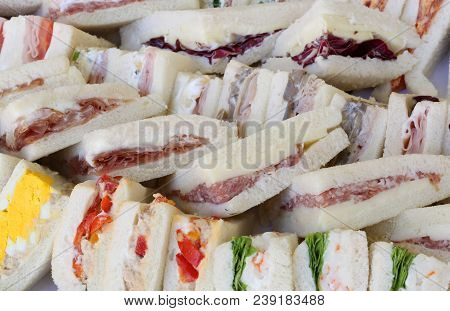 Background Of Big Sandwiches With Flat Bread  Salami And Bolied Eggs And Salad