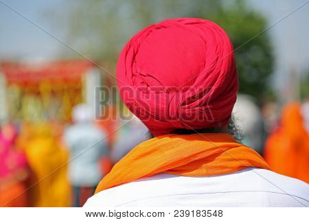 Sikh Man With Long Beard And Red Turban On His Head