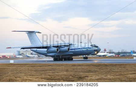 Il-76 Cargo Plane On A Background Of Clouds In The Early Morning Takes Off, Motion Blur
