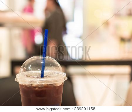 Ice Coffee Americano In Cup On Defocused Background.
