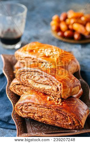 Traditional Turkish Pastry Roll With Chocolate And Nuts Filling - Pastich Served On A Vintage Tray.