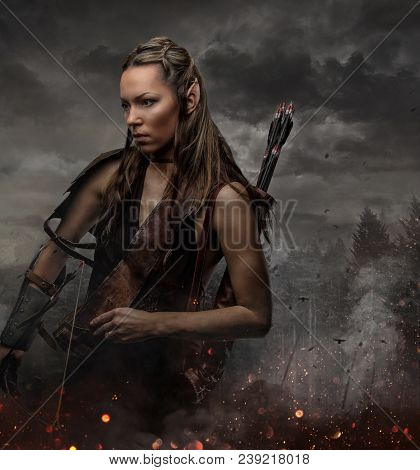 Portrait Of Elf Woman With Bowl In A Fire Sparks.