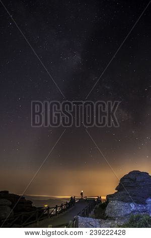 Starry Sky Background At Night In El Torcal De Antequera Natural Park, Andalusia, Spain. Some Of Lig