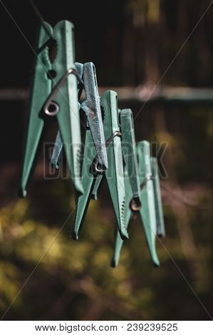 Old Plastic Clothespins On A Rope Hanging Outside House, Toned Green, Vintage Look