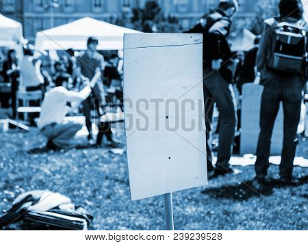 Empty Placard At Protest With Silhouette Of People In The Background - Vlue Color Cast