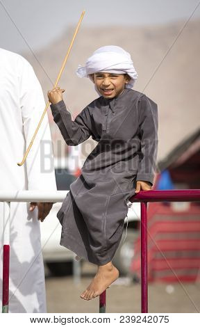 Ibri, Oman, 28th April 2018: Omani Kid At The Races With His Dad