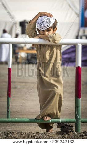 Ibri, Oman, 28th April 2018: Omani Kid At The Races With His Dad