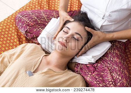 Beautiful Young Woman Having Head Massage In Spa Salon. Woman With Thai Massage. Woman With Relax Em