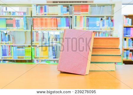Old Book Red - Green. Heap Are Interior Library School On Wooden Table And Blurry Bookshelves Backgr