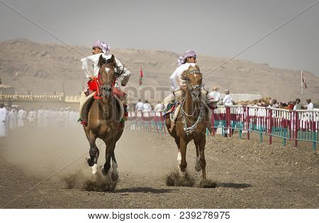 Ibri, Oman, 28th April 2018: Omani Men At A Traditional Horse Race Event Where Young Riders Show The