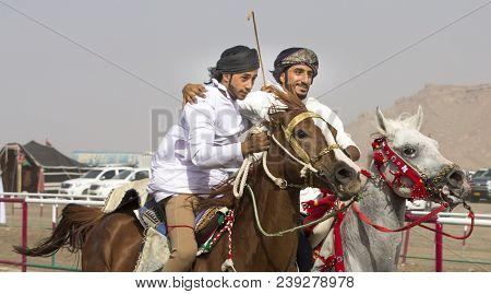 Ibri, Oman, 28th April 2018: Omani Men At A Traditional Horse Race Event Where Young Riders Show The