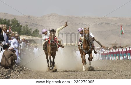Ibri, Oman, 28th April 2018: Omani Men At A Traditional Horse Race Event Where Young Riders Show The