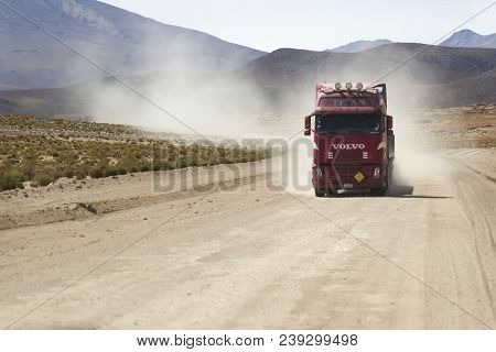 Bolivia - January 14, 2018: Truck On The Unpaved Road In Bolivia. At 2004 More Than 92% Of Roads In 
